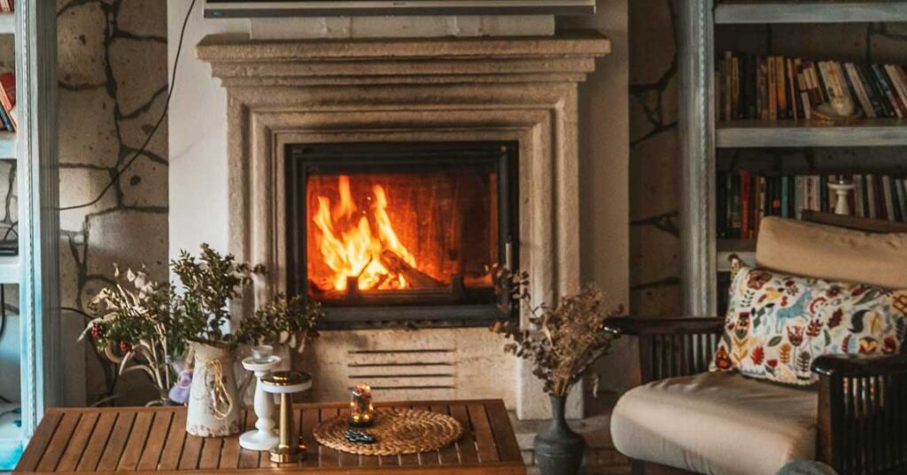 Fireplace restoration specialist repairing firebox masonry in a Syracuse NY home. A-Z Construction & Restoration